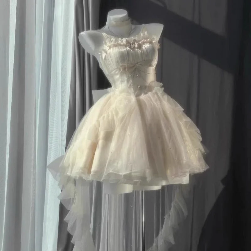 dress + trailing + bow + chain